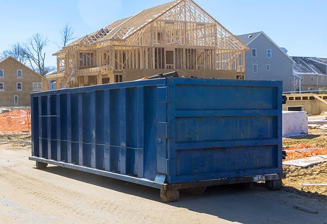 a brown dumpster placed n a residential area that has a ribbon of trash spilling out of it